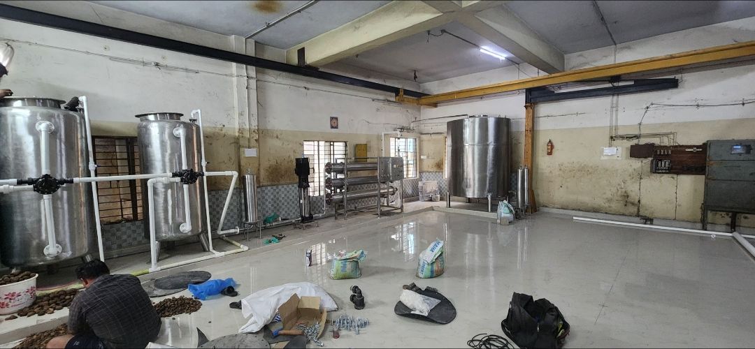 Complete RO plant installation: sand and carbon filters, RO skid and SS storage tank – PureFlux Engineering, Chennai