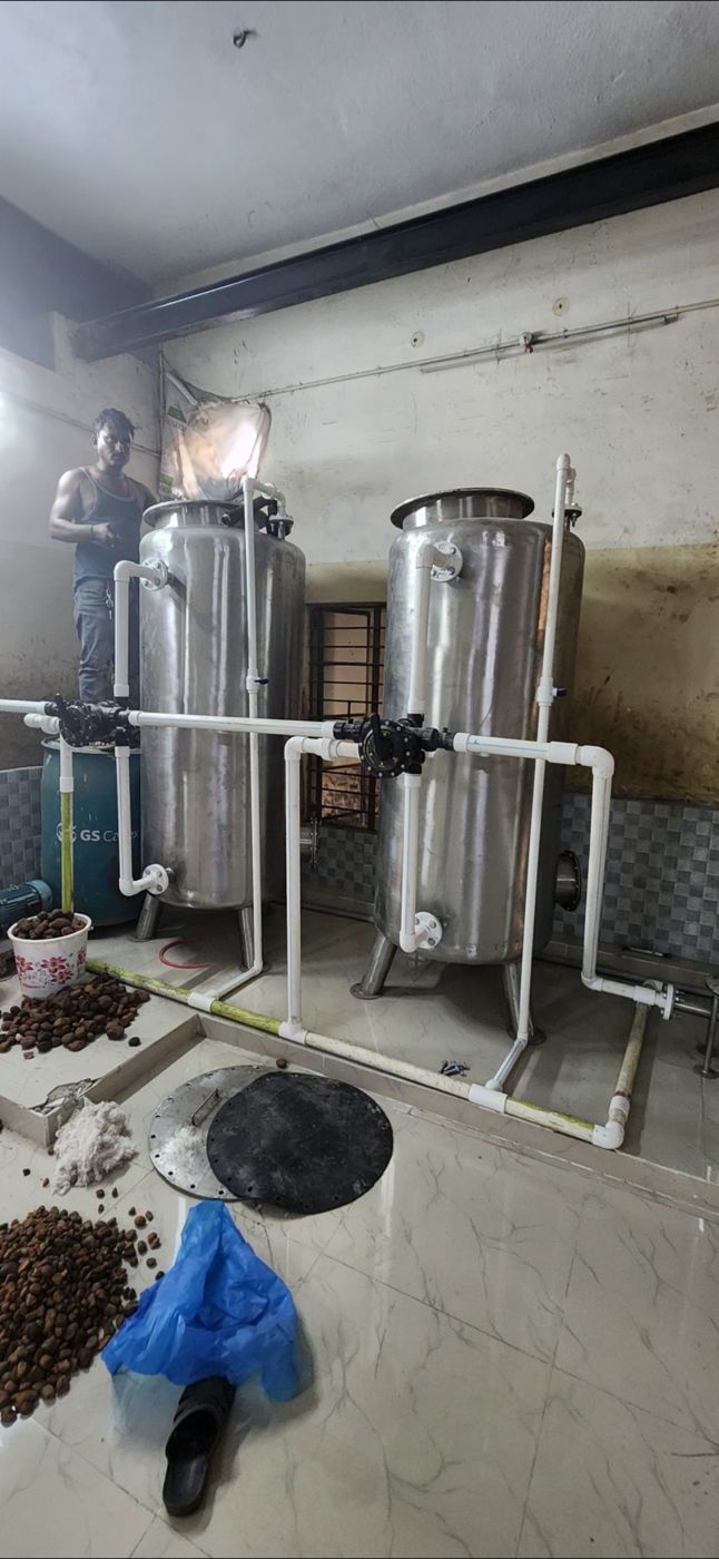 Loading new filter media into sand and carbon filters – PureFlux Engineering, Chennai