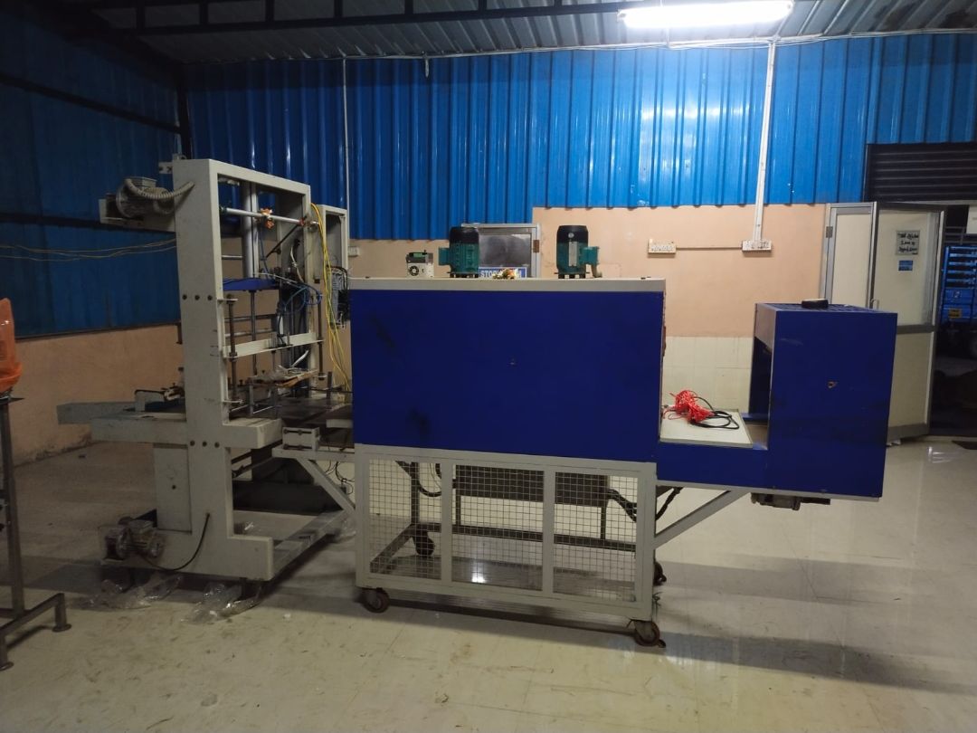Shrink wrapping machine for bottle packs – PureFlux Engineering, Chennai